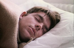 A man asleep in bed